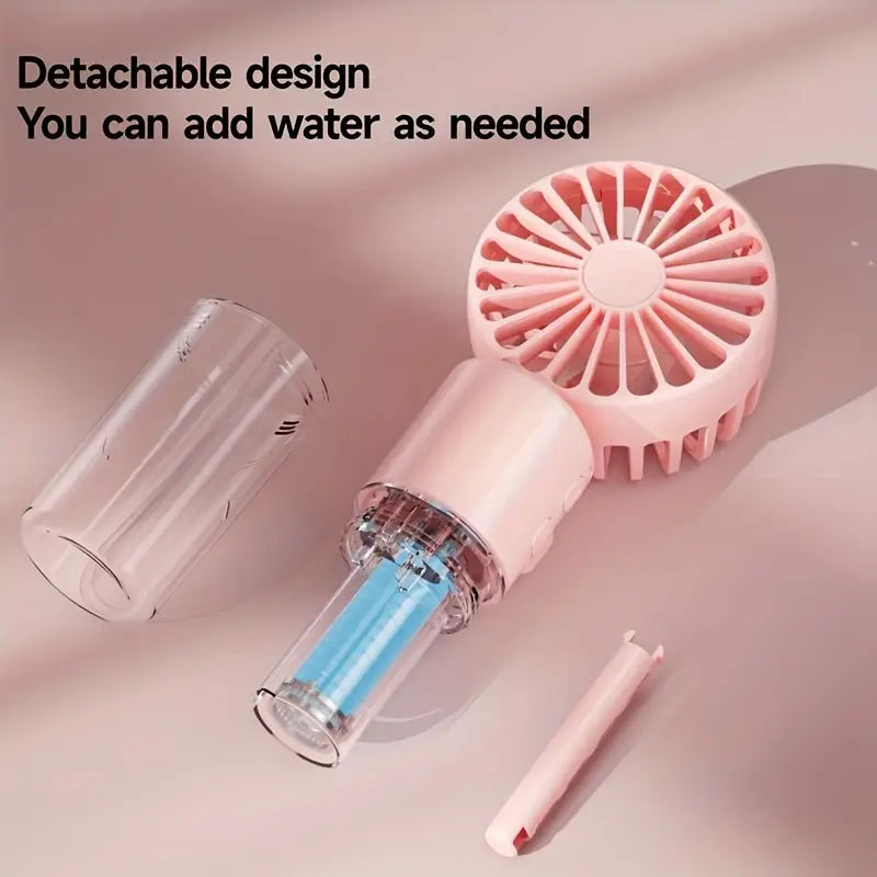 Portable mini fan with mist spray.